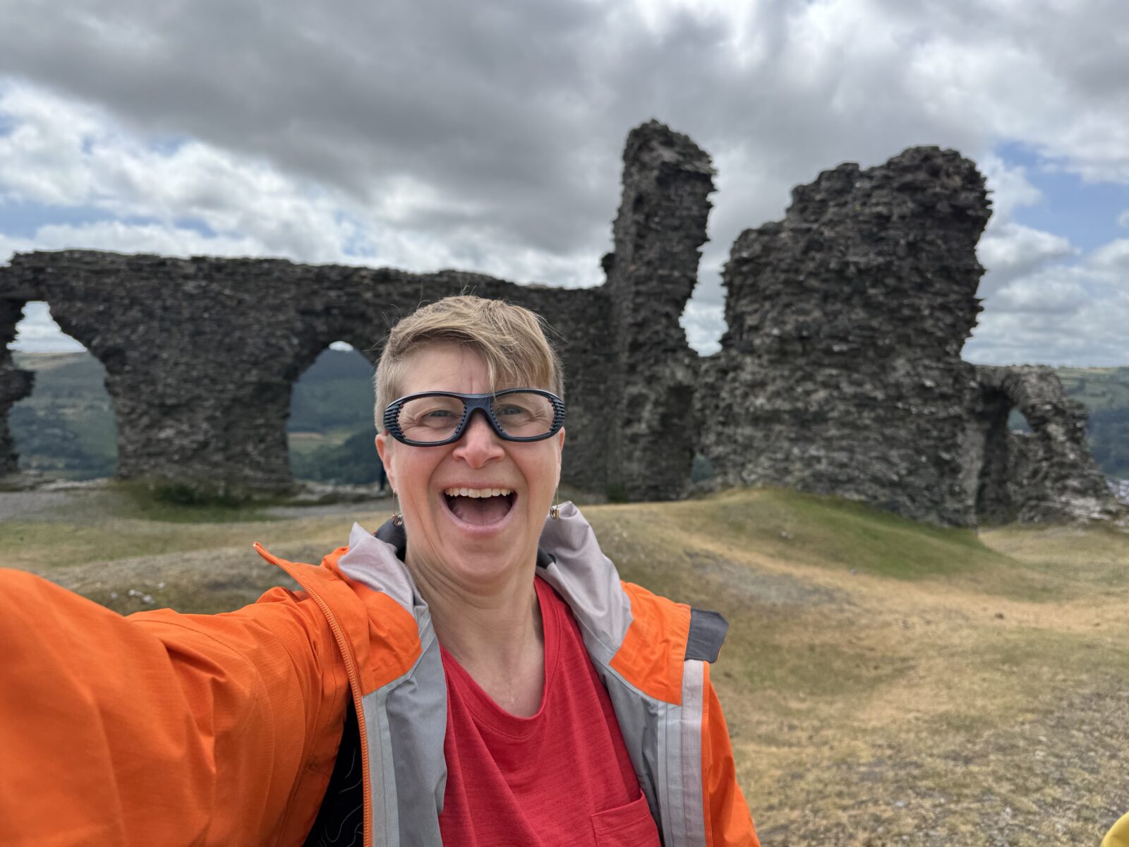Image of McLean Gunderson with view of Dinas Bran in the background. 